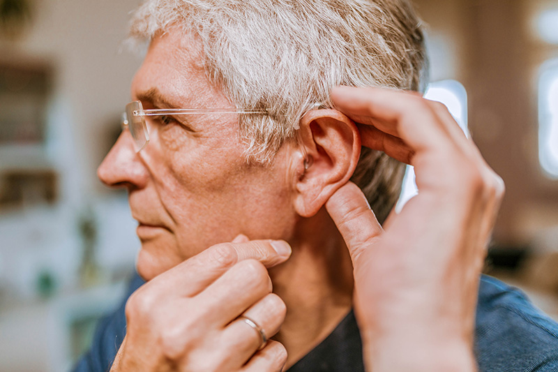 Patient getting a hearing aid